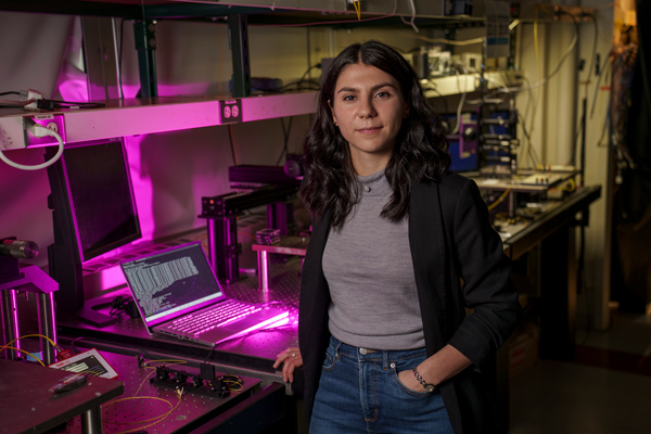 Sabrina Coresetti in lab with pink light