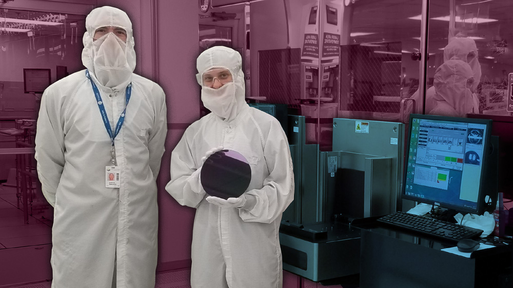 two researchers in lab holding silicon