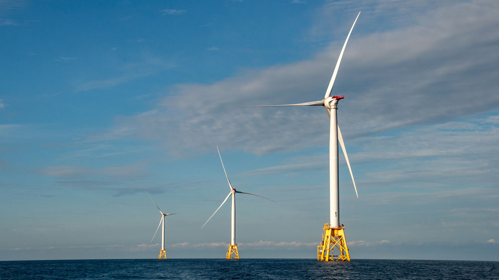 3 windmills in ocean
