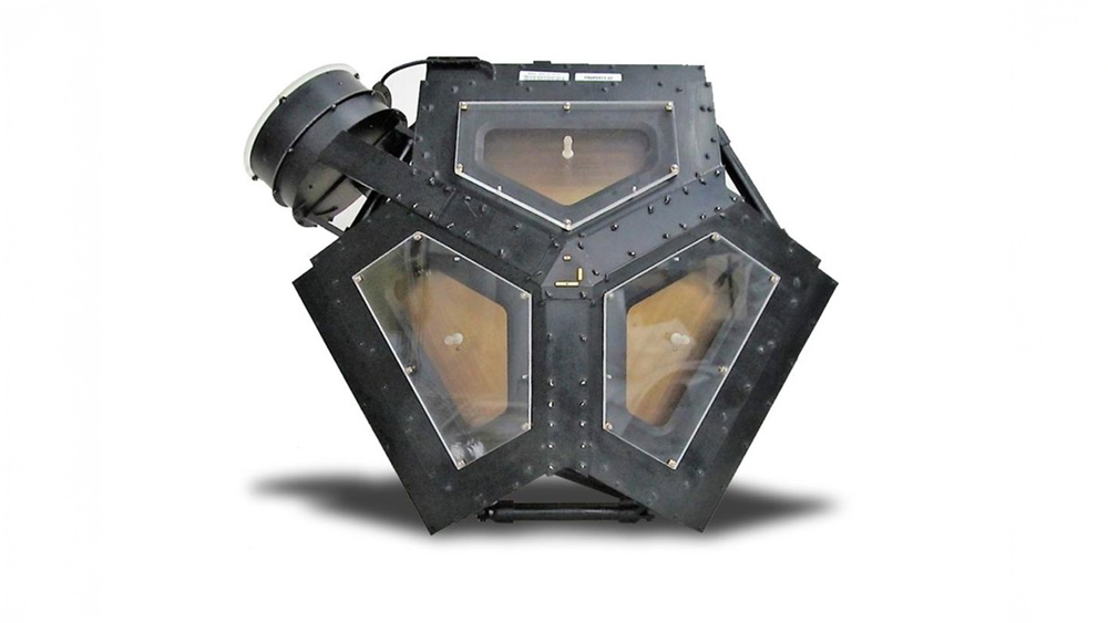 A bulky polygonal-shaped device has a cup that measures the direction of solar wind