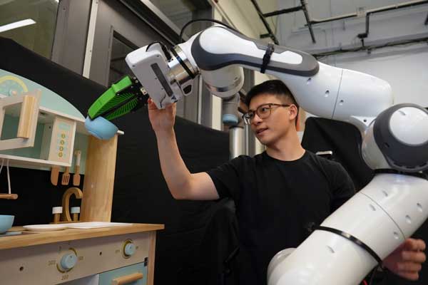 Person working on a robotic arm